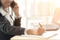 Close up of Business African American Woman Working sitting at her Desk Royalty Free Stock Photo