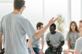Close up. business coach holds a debate with a group of young people Royalty Free Stock Photo