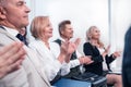 Close up. business colleagues applauding at a working meeting. Royalty Free Stock Photo