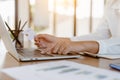 Close up business hands using laptop with mock up credit card for online payment transaction Royalty Free Stock Photo