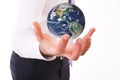 Business man carrying earth. Royalty Free Stock Photo