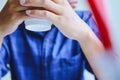 Business man hand holding coffee cup and thinking creative work in home office Royalty Free Stock Photo