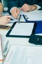 Close-up the business man hand pointing at the tblank tablet screen. Teamwork successful meeting. Royalty Free Stock Photo