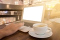 Close up of business man hand working on blank screen laptop computer in cafe blur or blurred soft focus. Royalty Free Stock Photo