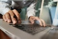 Close up of business man hand working on laptop computer Royalty Free Stock Photo