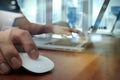 Close up of business man hand working on laptop computer on wood Royalty Free Stock Photo