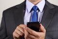 Close up of business man hands holding mobile phone Royalty Free Stock Photo