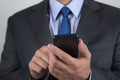 Close up of business man hands holding mobile phone Royalty Free Stock Photo