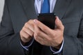 Close up of business man hands holding mobile phone Royalty Free Stock Photo