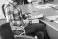 close up of business man hands typing on laptop with team on meeting in background Royalty Free Stock Photo