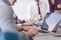 Close up of business man hands typing on laptop with team on mee Royalty Free Stock Photo