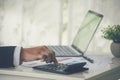 Close up business man hands using calculator counting tax financial bill. Man hands calculating number, data, graph, chart audit