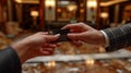 Close up of a business man\'s hand giving a credit card for payment in the hotel, Generative AI Royalty Free Stock Photo