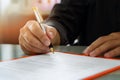 Close up of business man signing contract making a deal Royalty Free Stock Photo