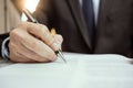 Close up business man signing documents or contract Royalty Free Stock Photo