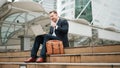 Close up of business man talking phone and celebrate successful project. Urbane. Royalty Free Stock Photo