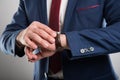 Close-up of business man wearing suit checking wrist watch Royalty Free Stock Photo