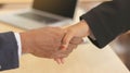 Close-up business men holding hands, Two businessmen are agreeing on business together and shaking hands after a successful