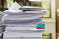 Close up of business papers stack on desk. Pile of unfinished documents on office desk Royalty Free Stock Photo