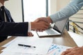 Close-up  of business partners shaking hands and.hand business men and women who shaking hands Royalty Free Stock Photo