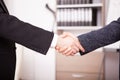 Close up of Business partners shaking hands in the office Royalty Free Stock Photo