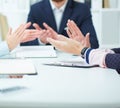 Close-up of business people clapping hands. Business seminar concept. Royalty Free Stock Photo