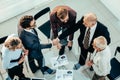 Close up. business people confirming a financial agreement with a handshake . Royalty Free Stock Photo