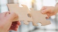 close up of business people connecting couple puzzle jigsaw, business solution concept. Royalty Free Stock Photo