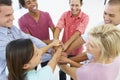 Close Up Of Business People Joining Hands In Team Building Exercise Royalty Free Stock Photo
