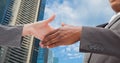 Close-up of business people shaking hands in city Royalty Free Stock Photo