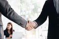 Close up of Business people shaking hands, finishing up meeting, business etiquette, congratulation, merger and acquisition