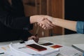 Close up of Business people shaking hands, finishing up meeting, business etiquette, congratulation, merger and Royalty Free Stock Photo