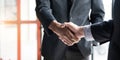 Close up of Business people shaking hands, finishing up meeting, business etiquette, congratulation, merger and Royalty Free Stock Photo