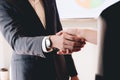 Close up of Business people shaking hands, finishing up meeting, business etiquette, congratulation, merger and acquisition Royalty Free Stock Photo