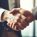 Close-up of business people shaking hands. Image is intentionally toned.