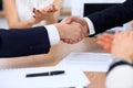 Close up of business people shaking hands at meeting or negotiation in the office. Partners are satisfied because Royalty Free Stock Photo