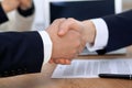 Close up of business people shaking hands at meeting or negotiation in the office. Partners are satisfied because Royalty Free Stock Photo