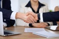 Close up of business people shaking hands at meeting or negotiation in the office. Partners are satisfied because Royalty Free Stock Photo