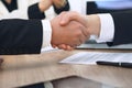 Close up of business people shaking hands at meeting or negotiation in the office. Partners are satisfied because Royalty Free Stock Photo