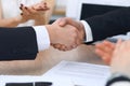 Close up of business people shaking hands at meeting or negotiation in the office. Partners are satisfied because Royalty Free Stock Photo