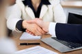 Close up of business people shaking hands at meeting or negotiation in the office. Partners are satisfied because Royalty Free Stock Photo