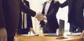 Close up of business people shaking hands in the office to confirm their partnership. Royalty Free Stock Photo