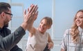 Close up.business team giving each other a high five. Royalty Free Stock Photo