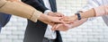 Close up business team of young man and woman showing unity with their hands together , unity success and teamwork concept Royalty Free Stock Photo