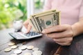 Close up of business woman with calculator counting money. saving money and financial concept Royalty Free Stock Photo