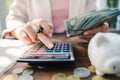 Close up of business woman with calculator counting money. saving money and financial concept Royalty Free Stock Photo