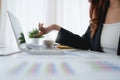 Close up Business woman hand pointing at laptop computer screen to analyze financial results and budget. Account Audit Royalty Free Stock Photo