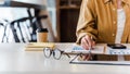 Close-up of business woman hands check company finance data reports at desk in modern office Royalty Free Stock Photo