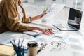 Close-up of business woman hands check company finance data reports at desk in modern office Royalty Free Stock Photo