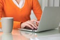 Close up of business woman hands typing on laptop computer